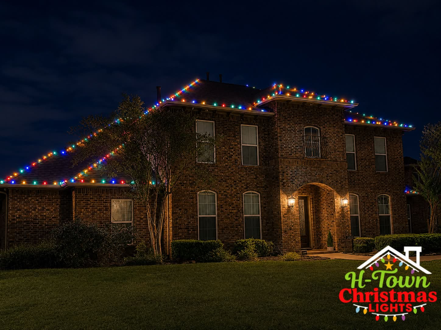 Multicolor Christmas light installation on a brick Houston-area home